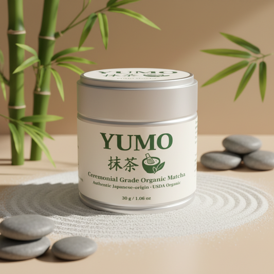 YUMO ceremonial grade organic matcha canister with bamboo and stones in the background